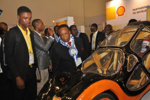 L- R. Eloghosa Iyamu, a student of the University of Benin, former Adviser to the President on Petroleum, Dr Emmanuel Egbogah inspecting a car built by students of the institution for the Shell Eco-marathon competition at the 2015 conference and exhibition of the Society of Engineers in Lagos.