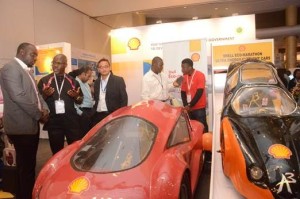 Kakayor Omagbemi of the The Shell Petroleum Development Company of Nigeria Ltd (SPDC), explaining about the energy efficient cars made by student of University of Lagos and University of Benin at the 2015 conference and exhibition of the Society of Engineers in Lagos. With the active support of SPDC, the studentsdesigned and built the cars for the annual Shell Eco-marathon competition in Rotterdam.
