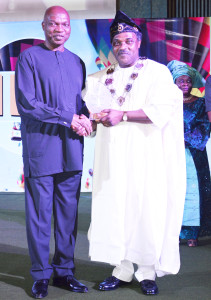 The Managing Director of The Shell Petroleum Development Company of Nigeria Ltd (SPDC) Mr. Osagie Okunbor (left) receiving a Special Recognition Award from the President, Chartered Institute of Personnel Management, Mr. Tony Arabome, at the 47th annual conference of the CIPM held in Abuja on October 15. 
