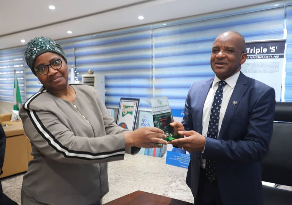 Director General, Nigerian Maritime Administration and Safety Agency (NIMASA), Dr Bashir Jamoh OFR (right) receiving the 'Outstanding Service to Taxation Profession' award conferred on him by the Chartered Institute of Taxation of Nigeria, CITN from Director Internal Audit NIMASA, Mrs Olamide Odusanya at the NIMASA headquarters in Lagos